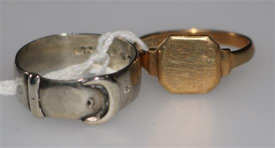 A 9ct gold signet ring and a silver buckle ring.